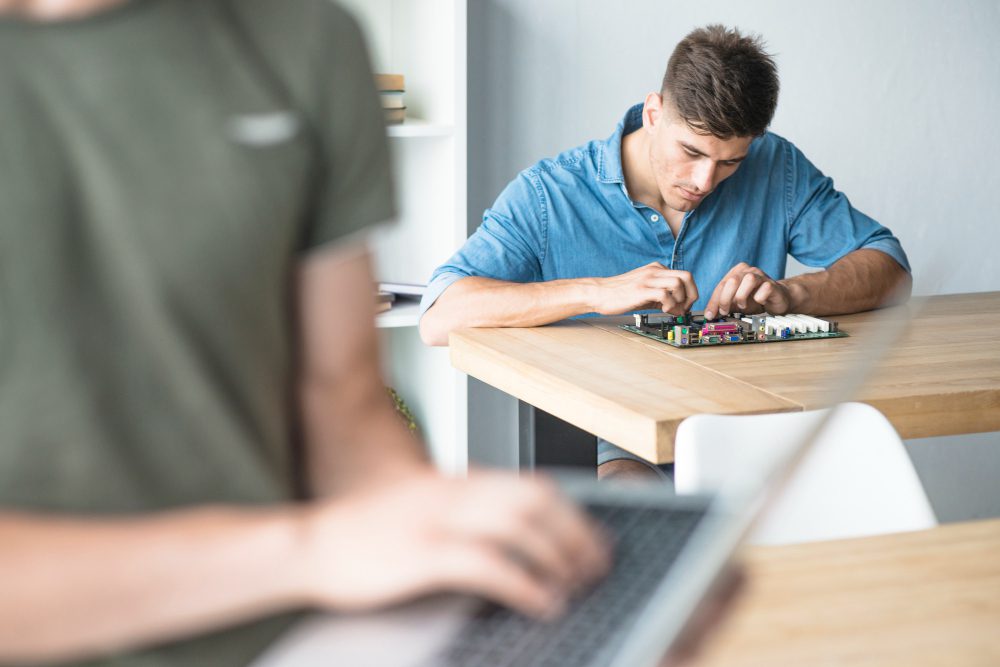 A man is woring on the hardware component