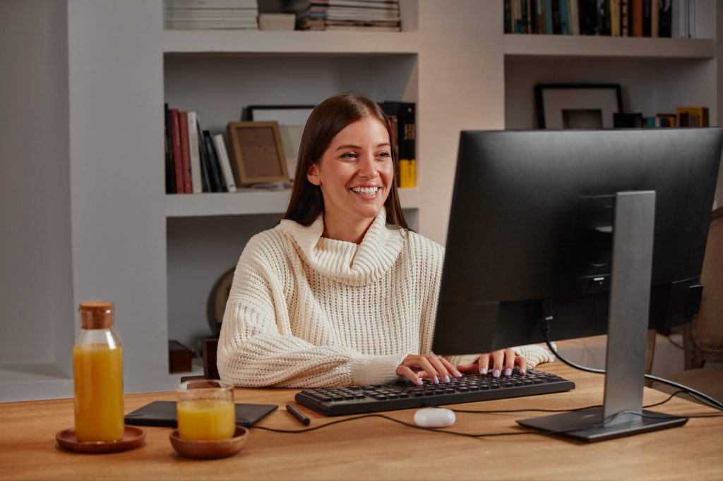 Professional working confidently at a home office desk